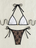 Black lace halter top with floral pattern and nude bikini