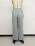 Belted casual straight-leg pants with contrasting trim and elastic waist