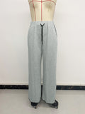 Belted casual straight-leg pants with contrasting trim and elastic waist