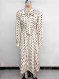 Elegant mid-length skirt with bow tie collar, long sleeves and waist polka dot dress