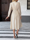 Elegant mid-length skirt with bow tie collar, long sleeves and waist polka dot dress